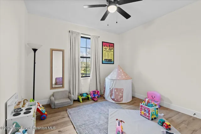 a bedroom with furniture and a window