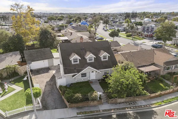 an aerial view of a house with a garden