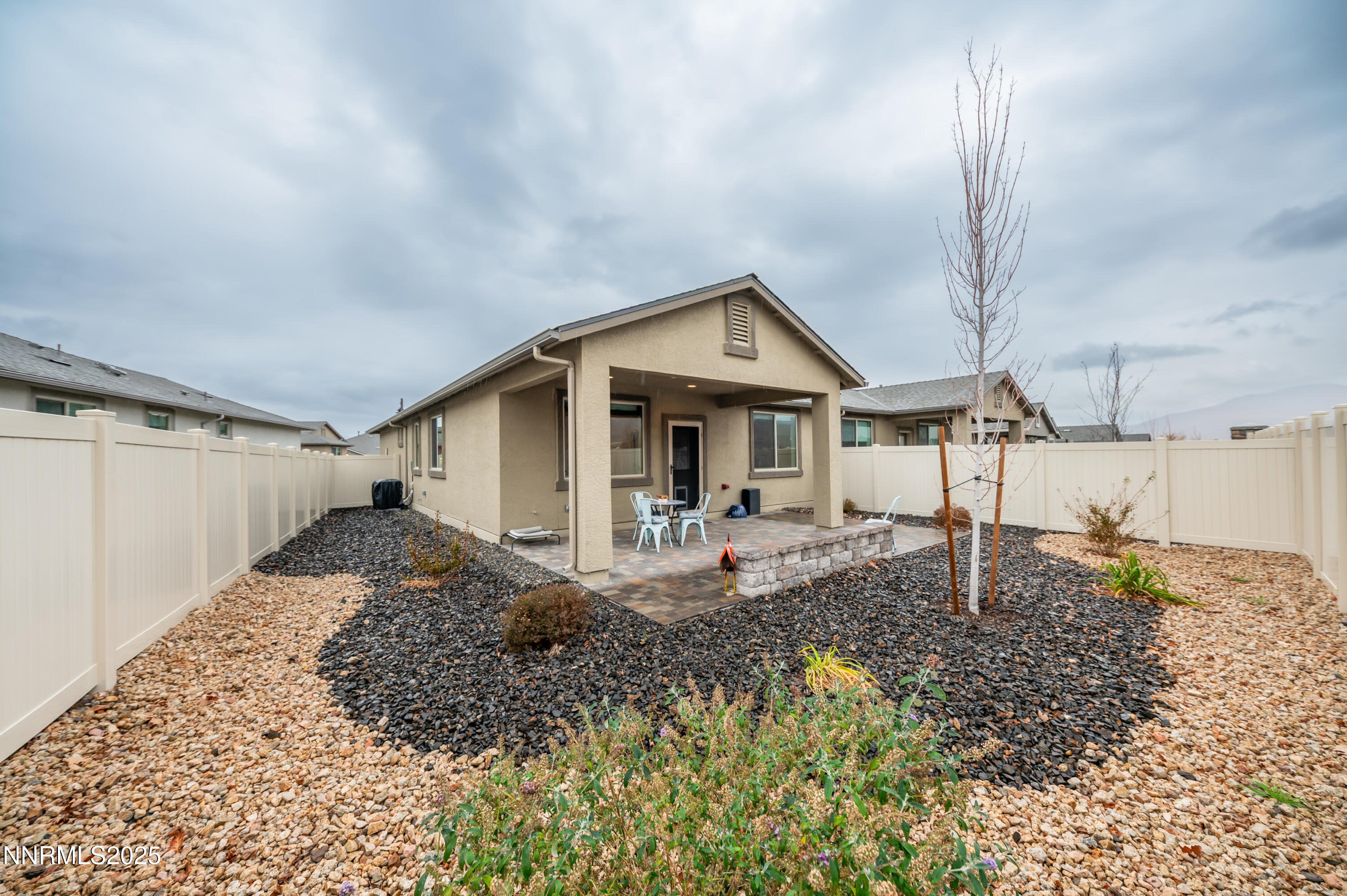 10834 Farmstead Lane Reno, NV 89521 - Photo 18 of 20 a front view of a house with garden
