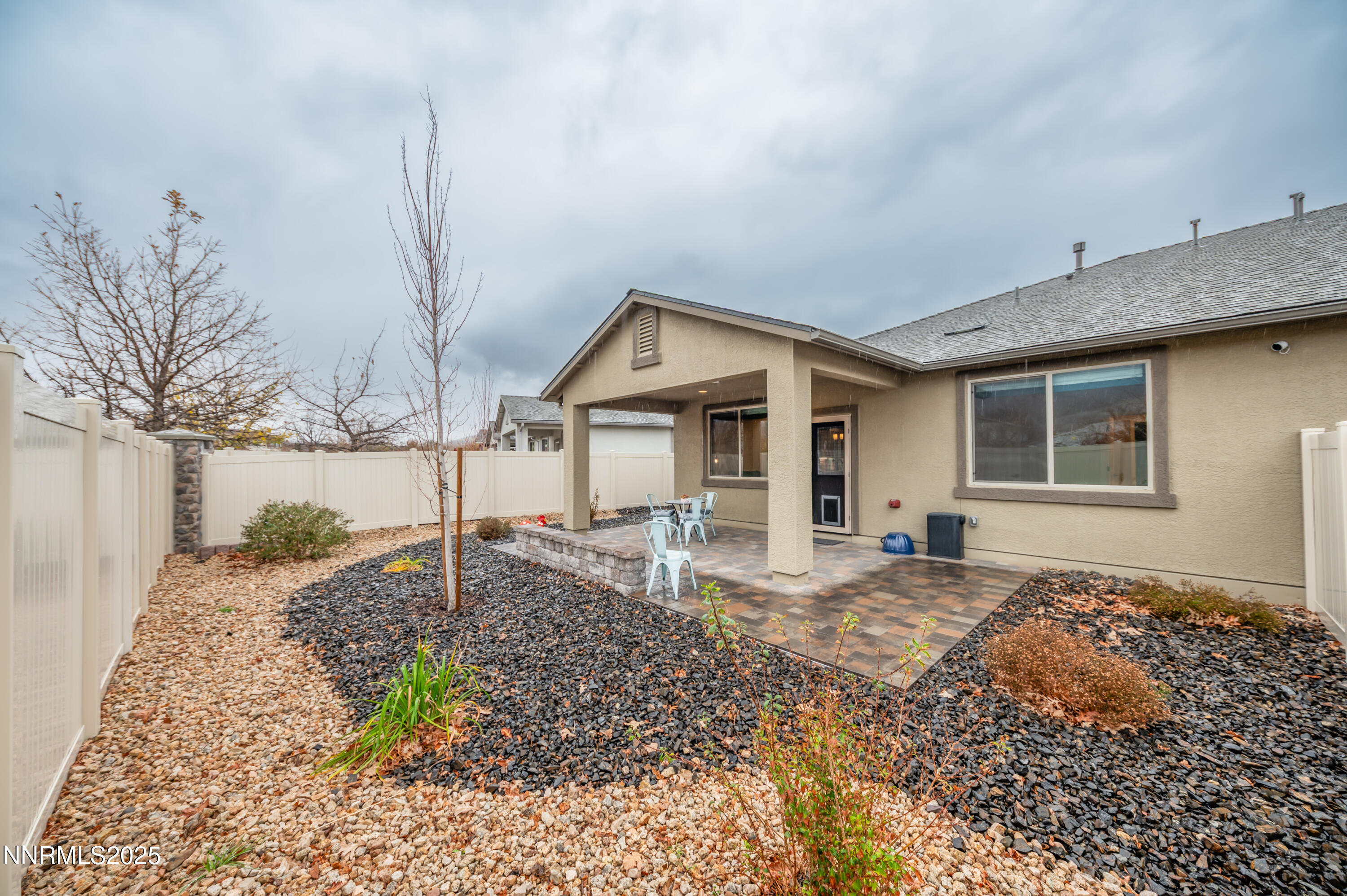 10834 Farmstead Lane Reno, NV 89521 - Photo 19 of 20 a front view of a house with garden