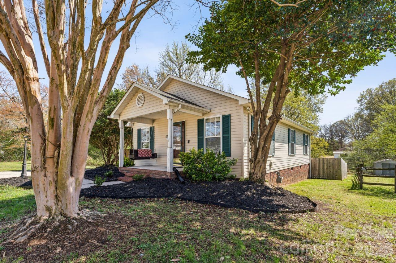 610 Eddleman Road Kannapolis, NC 28083 - Photo 1 of 34 a view of a house with backyard and a tree