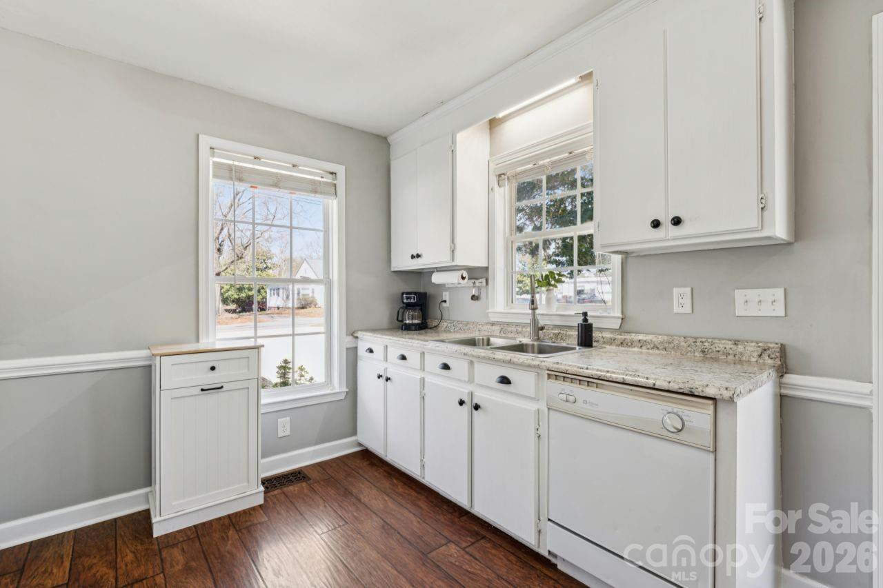 610 Eddleman Road Kannapolis, NC 28083 - Photo 13 of 34 a kitchen with cabinets appliances a sink and a window