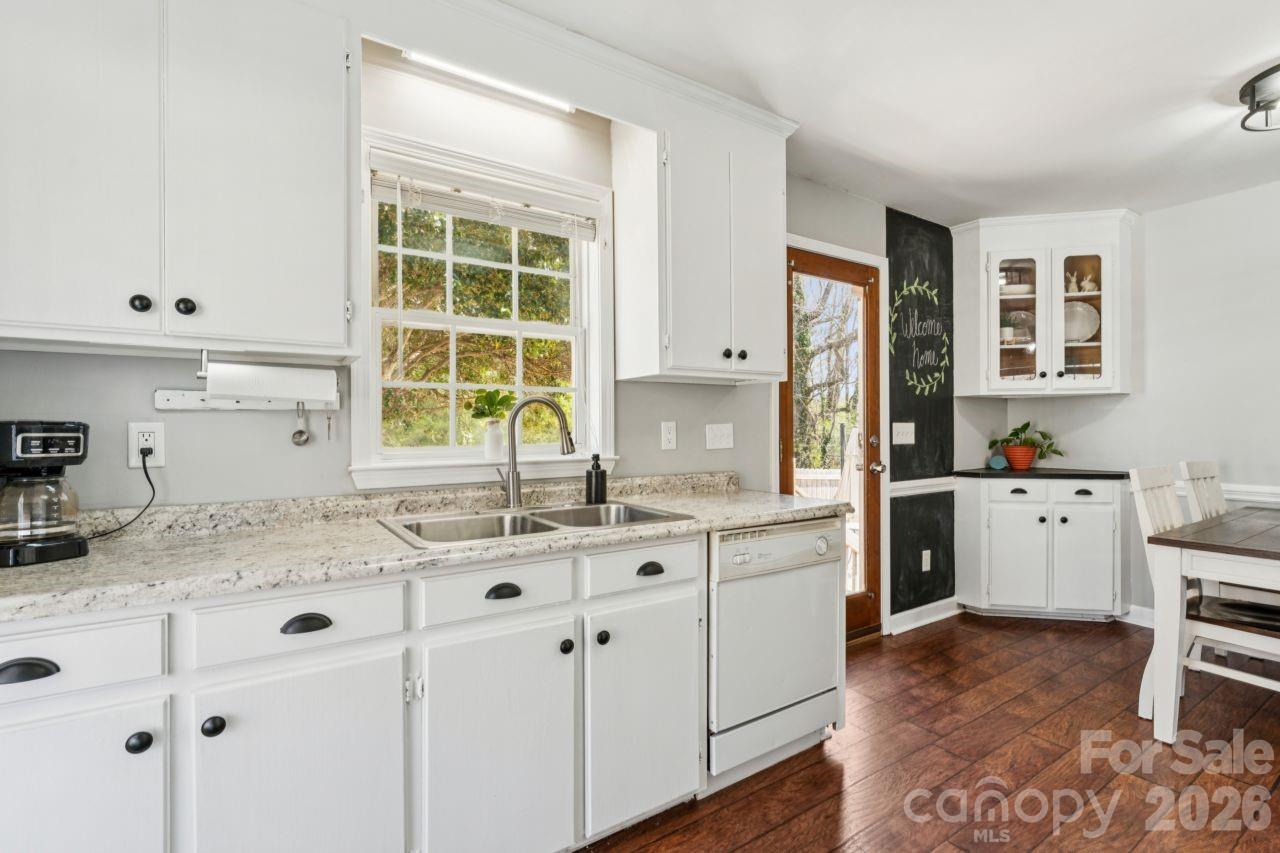 610 Eddleman Road Kannapolis, NC 28083 - Photo 14 of 34 a kitchen with a sink cabinets and window
