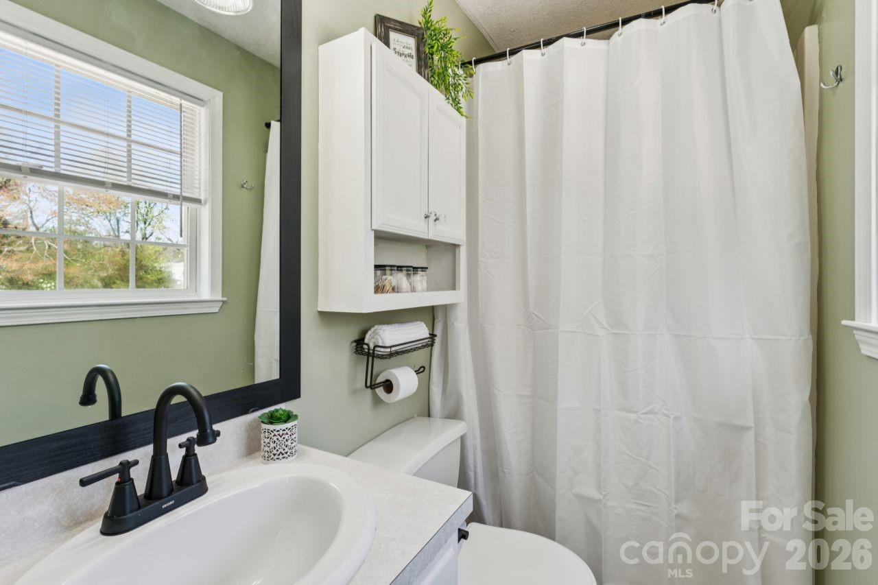 610 Eddleman Road Kannapolis, NC 28083 - Photo 23 of 34 a bathroom with a sink a toilet and a mirror