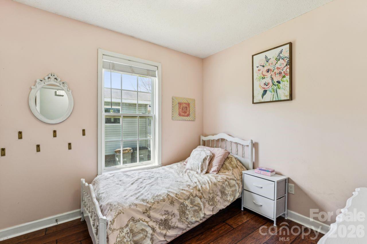 610 Eddleman Road Kannapolis, NC 28083 - Photo 24 of 34 a bedroom with a bed and wooden floor