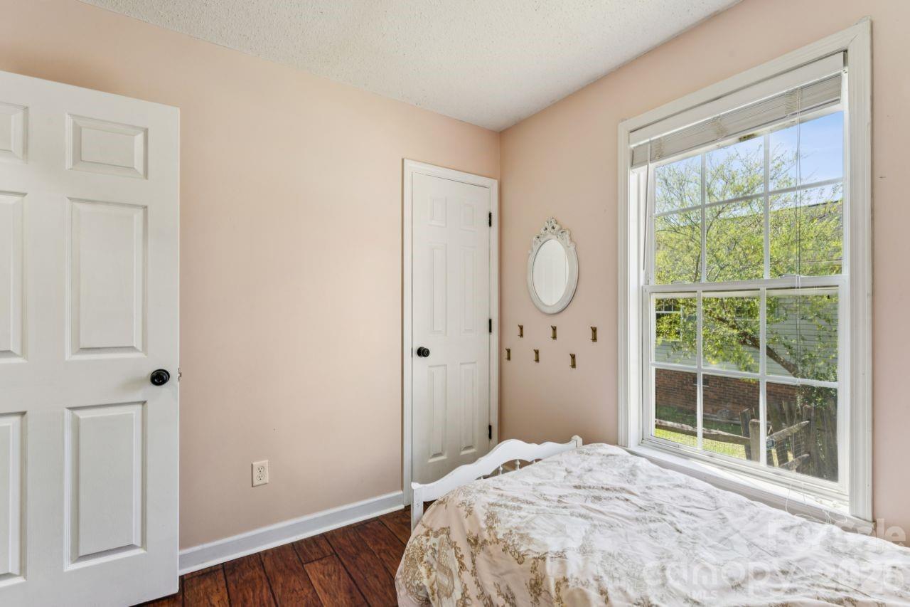 610 Eddleman Road Kannapolis, NC 28083 - Photo 25 of 34 a bedroom with a bed mirror and a window