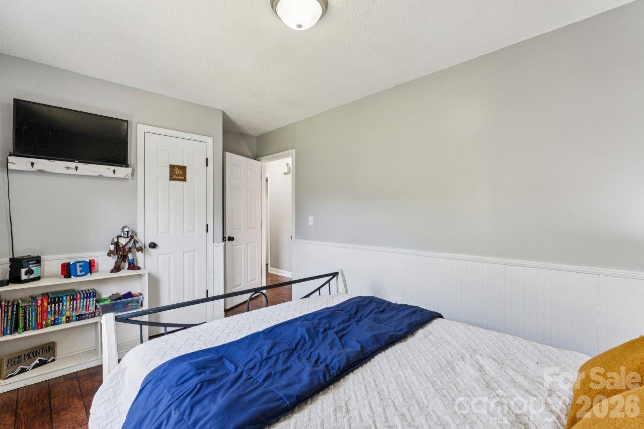 610 Eddleman Road Kannapolis, NC 28083 - Photo 27 of 34 a bedroom with a bed and a flat screen tv