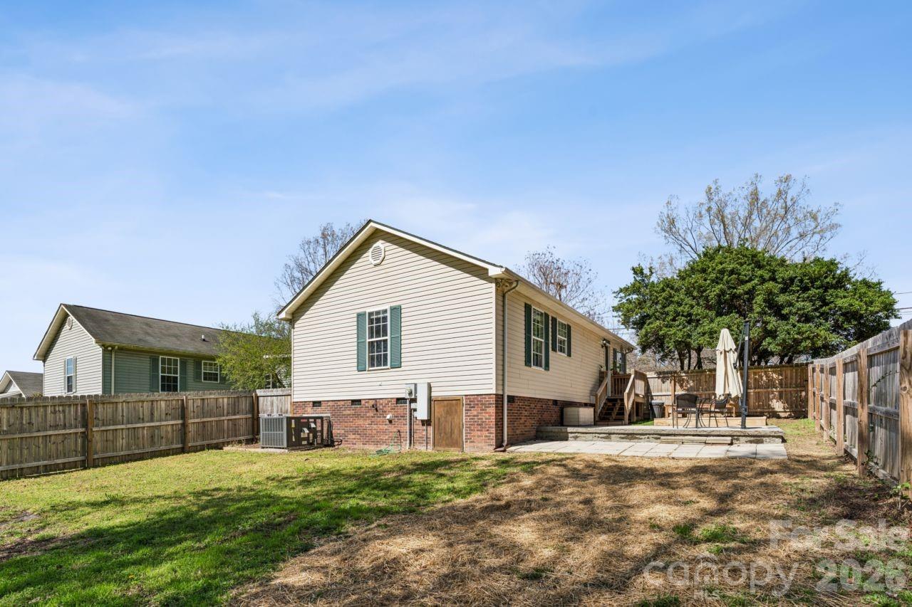 610 Eddleman Road Kannapolis, NC 28083 - Photo 32 of 34 a view of a house with a yard and potted plants