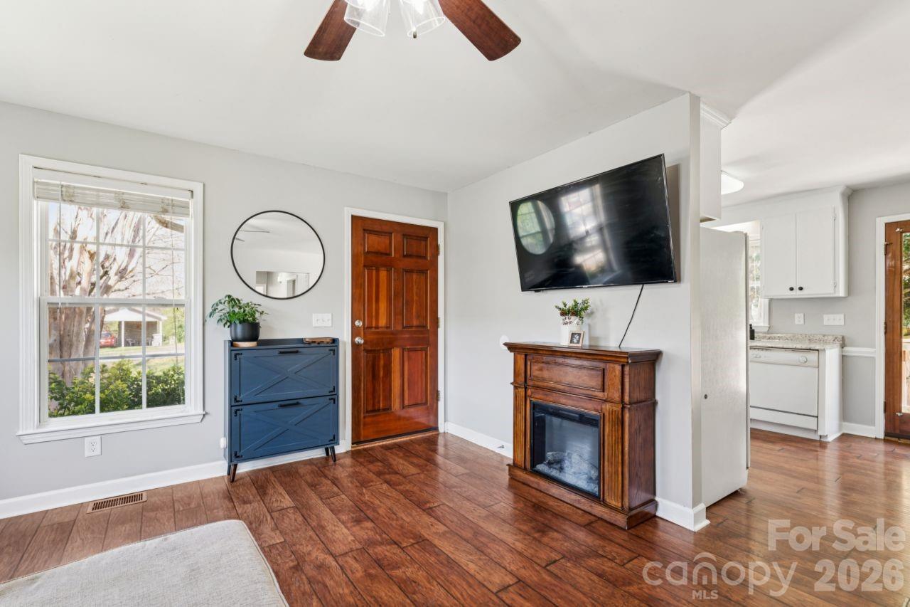 610 Eddleman Road Kannapolis, NC 28083 - Photo 7 of 34 a living room with furniture a flat screen tv and a fireplace