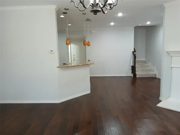 a kitchen with stainless steel appliances granite countertop a refrigerator a stove and a sink