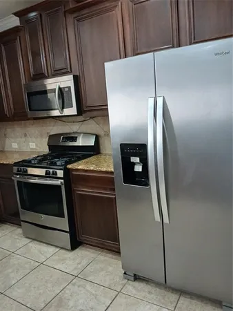 a white toilet sitting next to a shower