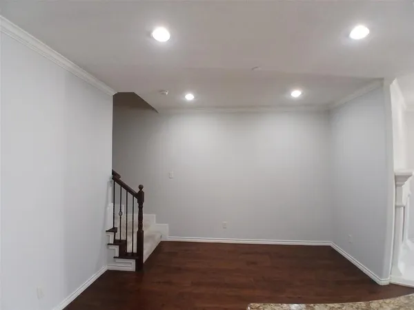 an empty room with a empty space and a window