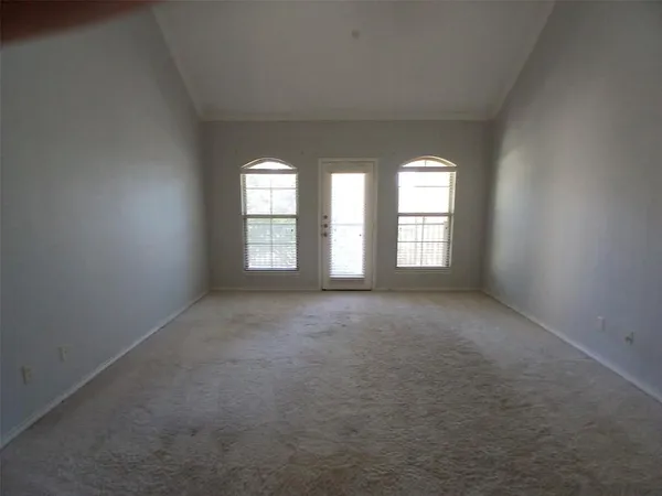 a bathroom with a tub a sink and a mirror