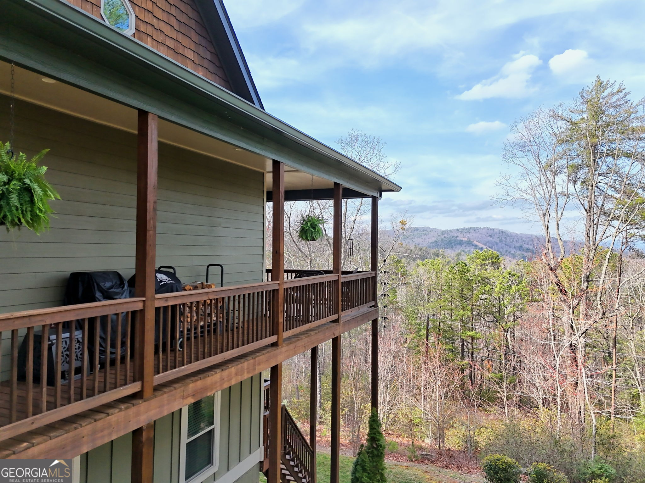 421 Hickory Nut Mountain Road Tallulah Falls, GA 30573 - Photo 105 of 117 a view of balcony with floor to ceiling window and wooden floor