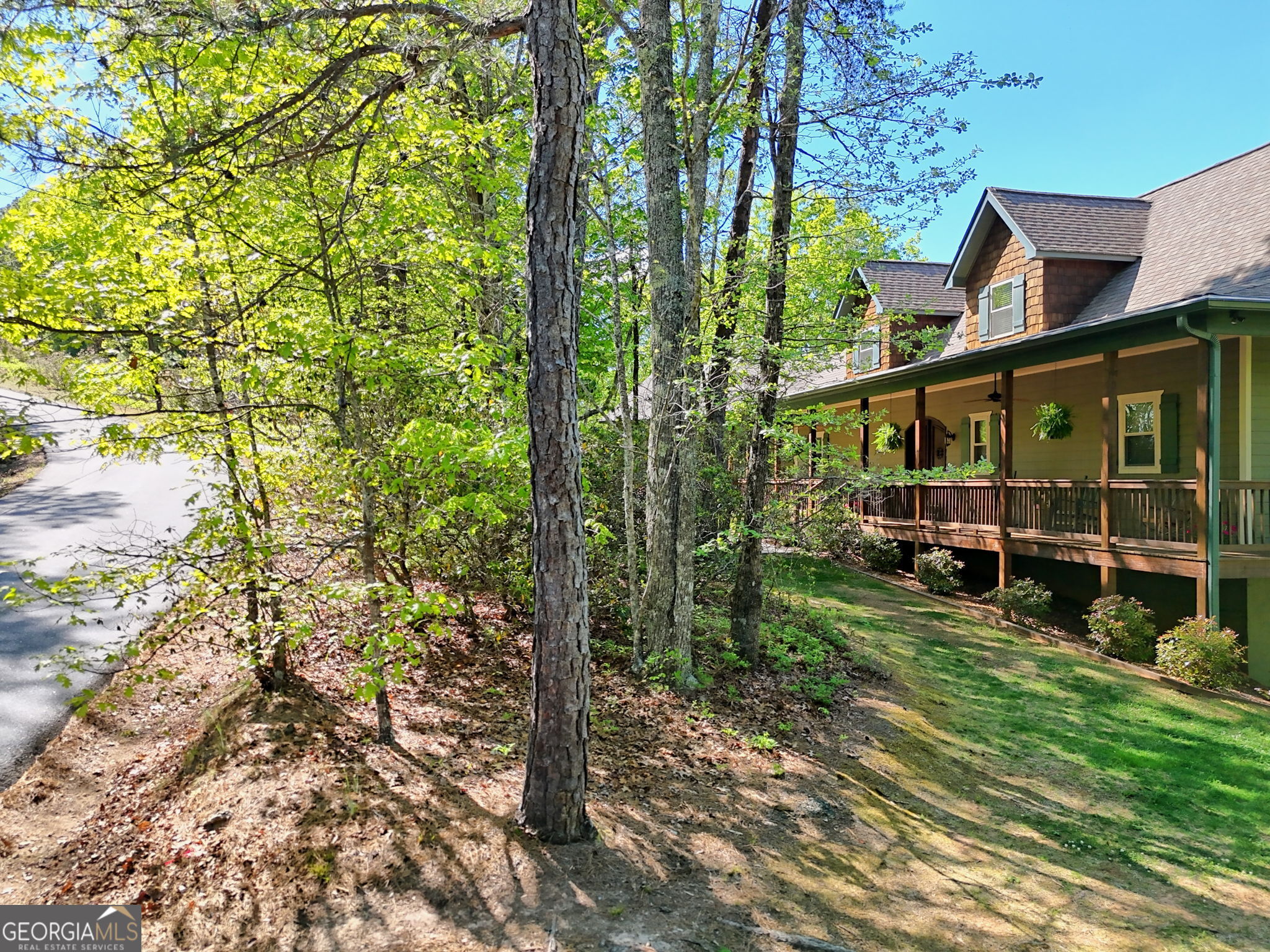 421 Hickory Nut Mountain Road Tallulah Falls, GA 30573 - Photo 116 of 117 a view of a house with a tree in a yard