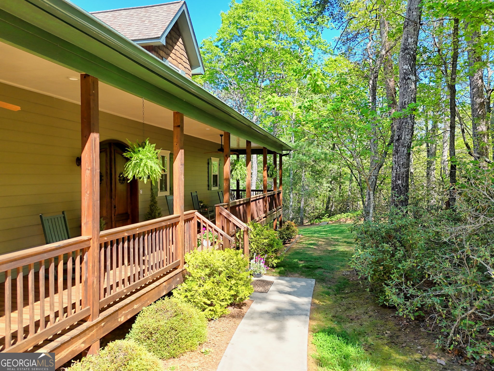 421 Hickory Nut Mountain Road Tallulah Falls, GA 30573 - Photo 12 of 117 a view of a house with backyard and sitting area