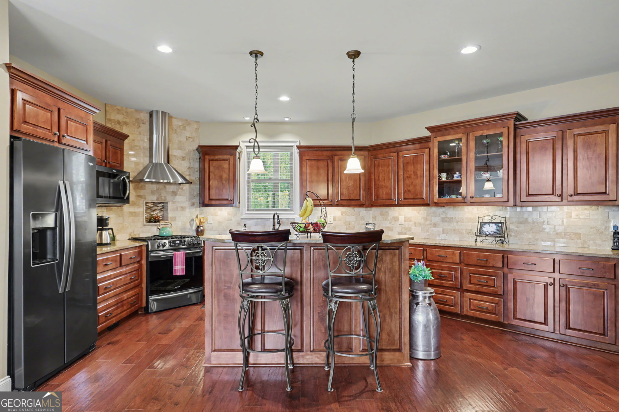 421 Hickory Nut Mountain Road Tallulah Falls, GA 30573 - Photo 23 of 117 a kitchen with stainless steel appliances granite countertop a refrigerator a sink dishwasher a stove and white cabinets with wooden floor