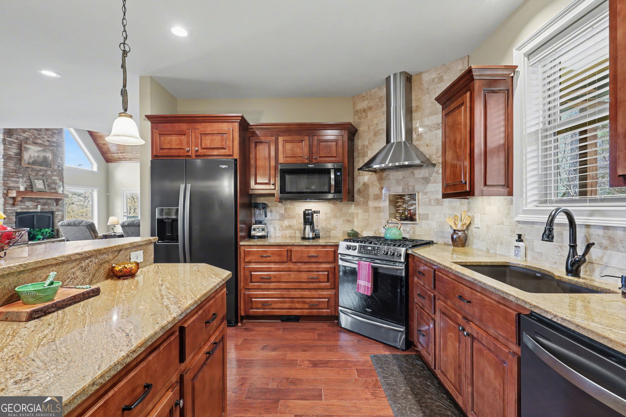 421 Hickory Nut Mountain Road Tallulah Falls, GA 30573 - Photo 25 of 117 a kitchen with stainless steel appliances granite countertop a sink stove and refrigerator