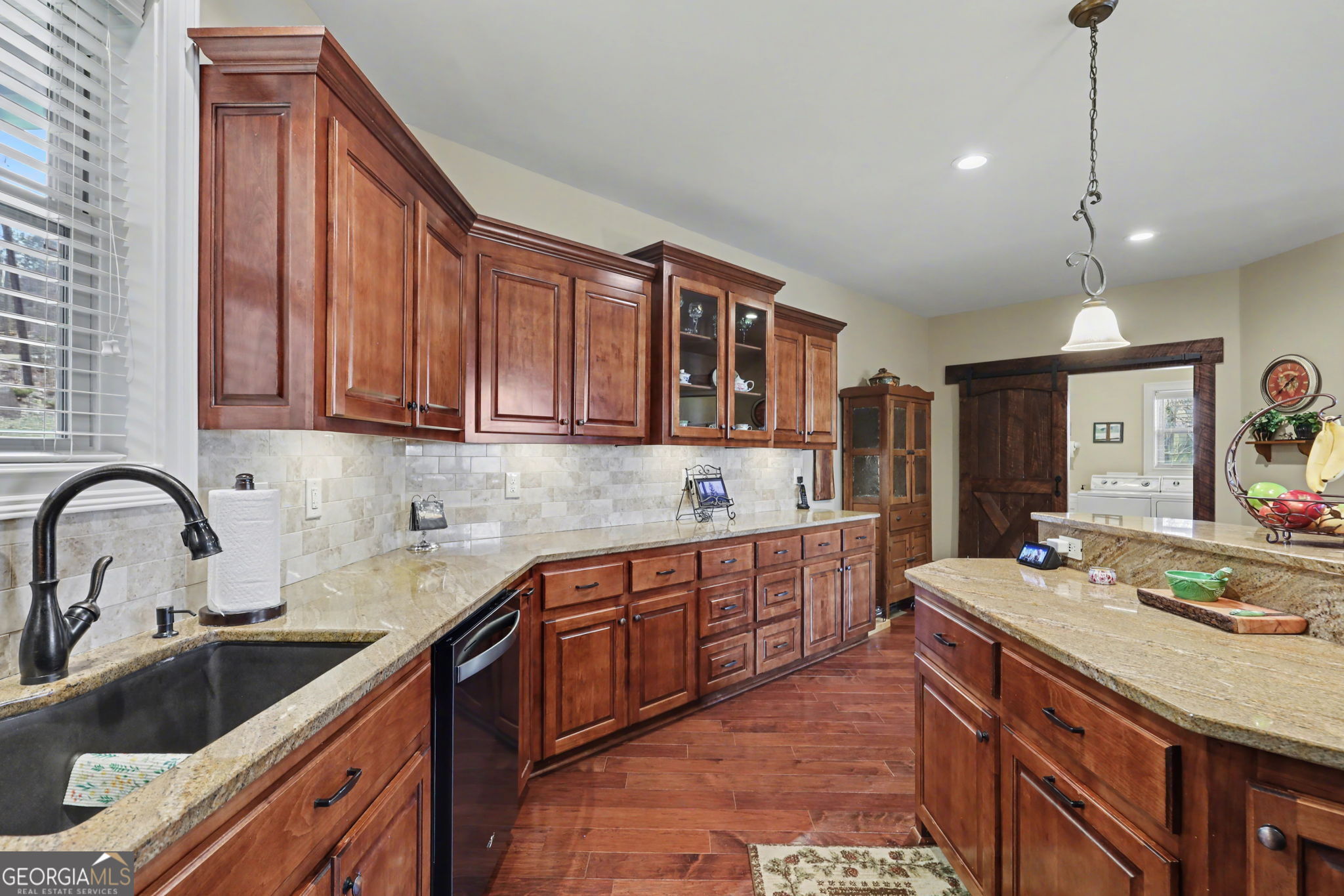 421 Hickory Nut Mountain Road Tallulah Falls, GA 30573 - Photo 27 of 117 a kitchen with stainless steel appliances granite countertop a sink stove and cabinets
