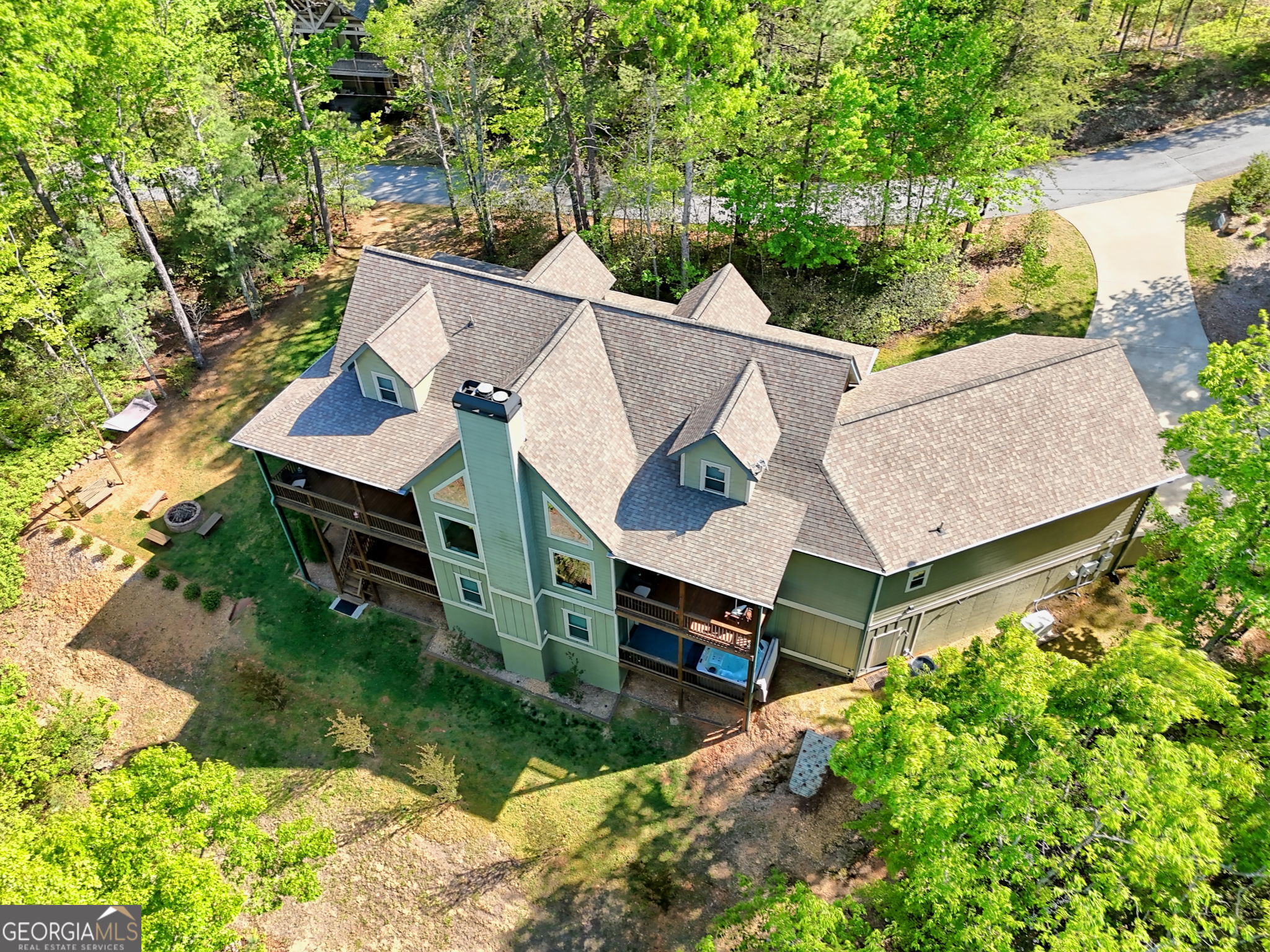 421 Hickory Nut Mountain Road Tallulah Falls, GA 30573 - Photo 4 of 117 an aerial view of a house with a yard