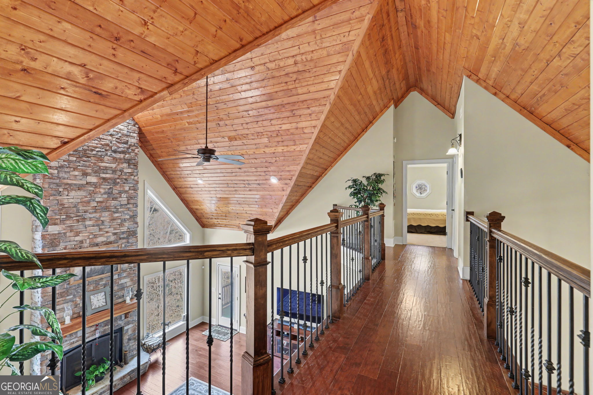 421 Hickory Nut Mountain Road Tallulah Falls, GA 30573 - Photo 44 of 117 a view of a balcony with wooden floor and stairs