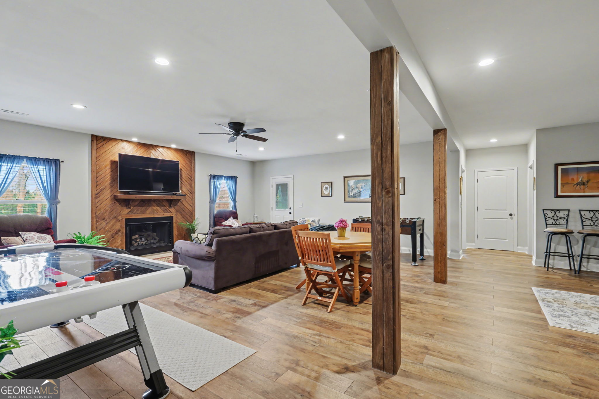 421 Hickory Nut Mountain Road Tallulah Falls, GA 30573 - Photo 50 of 117 a living room with furniture a flat screen tv and kitchen view