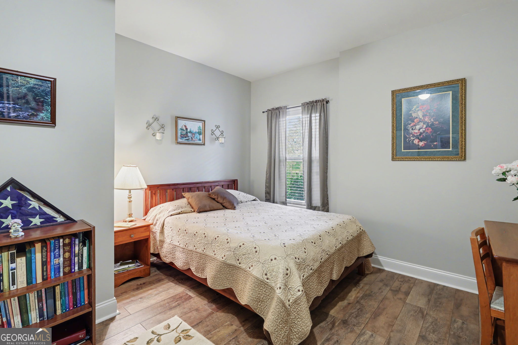 421 Hickory Nut Mountain Road Tallulah Falls, GA 30573 - Photo 53 of 117 a bedroom with a bed a book shelf and a window