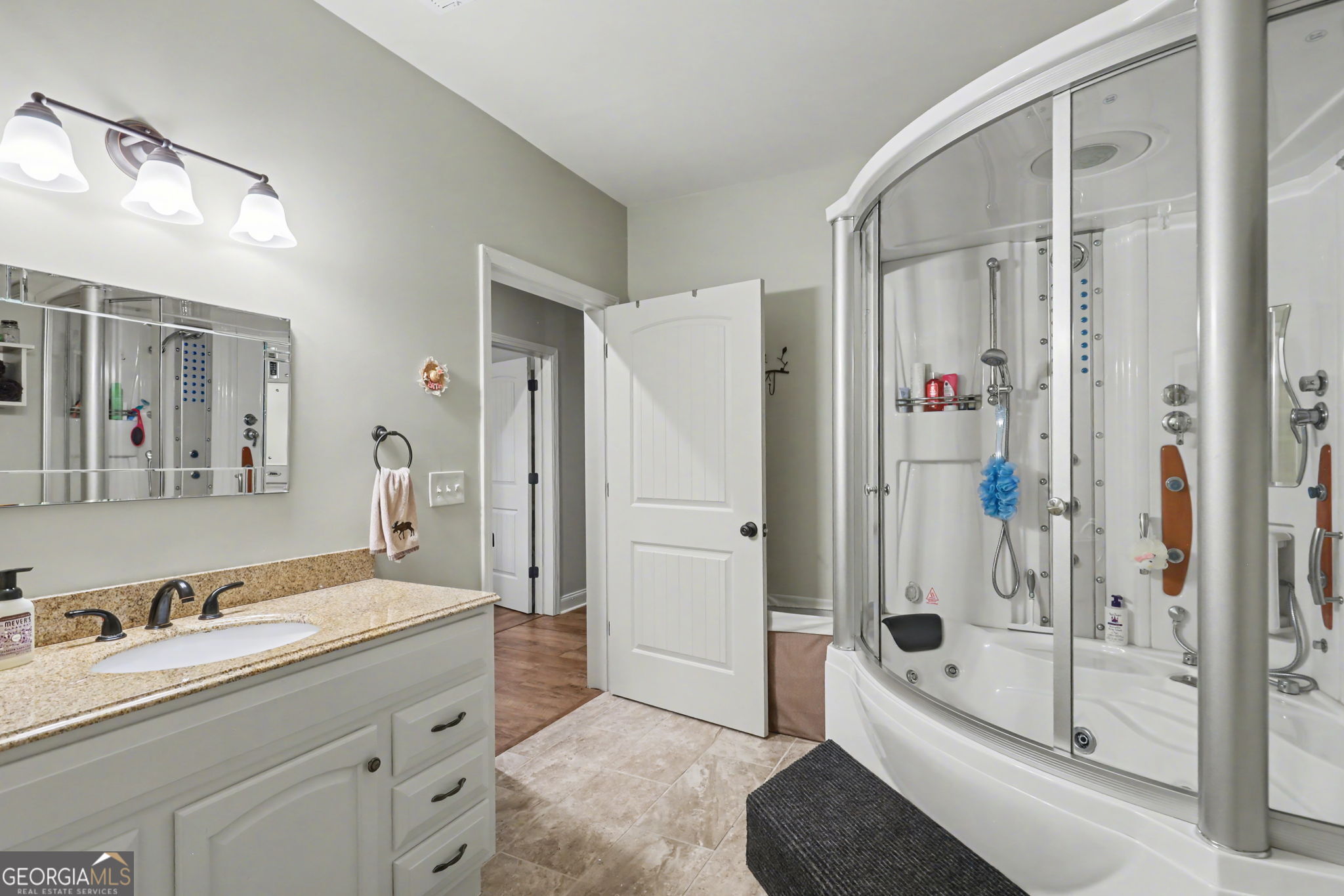 421 Hickory Nut Mountain Road Tallulah Falls, GA 30573 - Photo 56 of 117 a bathroom with a tub sink toilet and shower