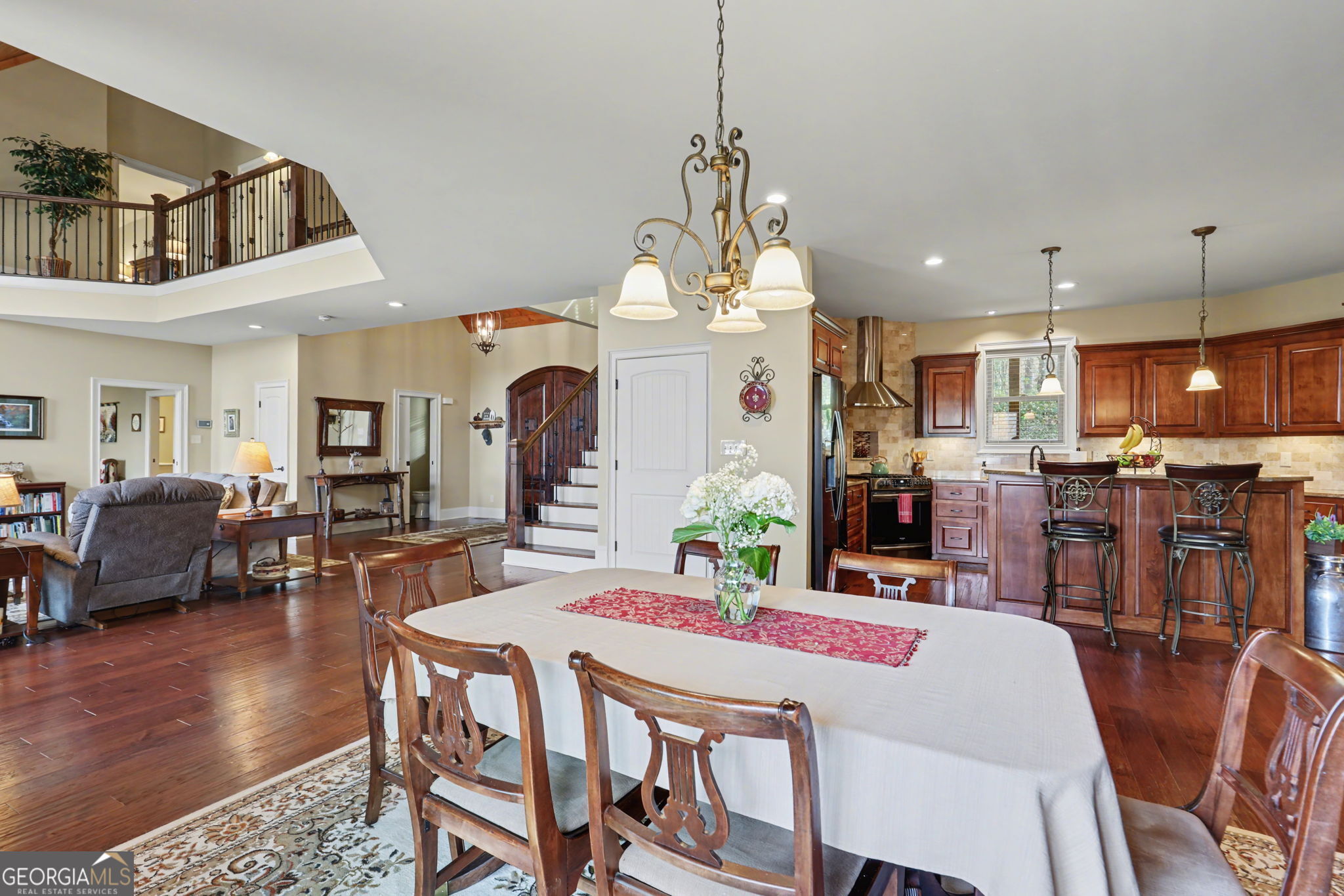 421 Hickory Nut Mountain Road Tallulah Falls, GA 30573 - Photo 71 of 117 a view of a dining room and livingroom with furniture wooden floor a chandelier
