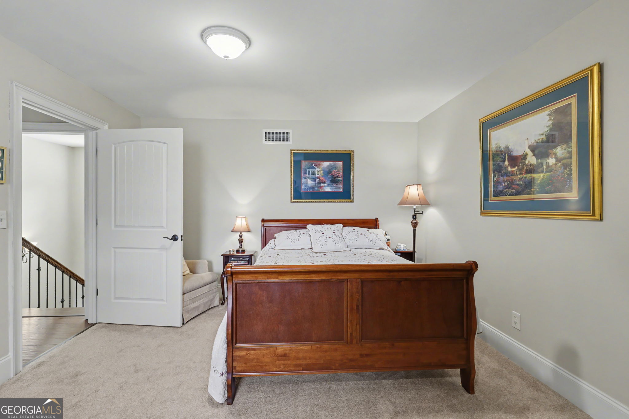 421 Hickory Nut Mountain Road Tallulah Falls, GA 30573 - Photo 82 of 117 a bed room with a bed and a painting