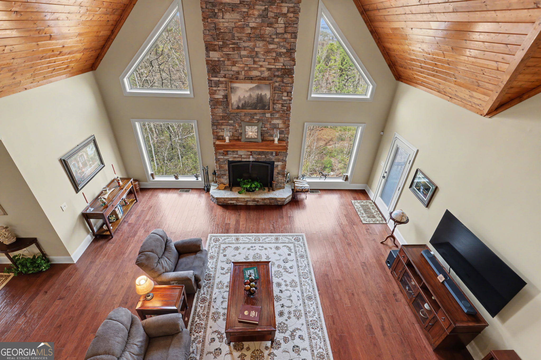 421 Hickory Nut Mountain Road Tallulah Falls, GA 30573 - Photo 86 of 117 a living room with furniture and a fireplace