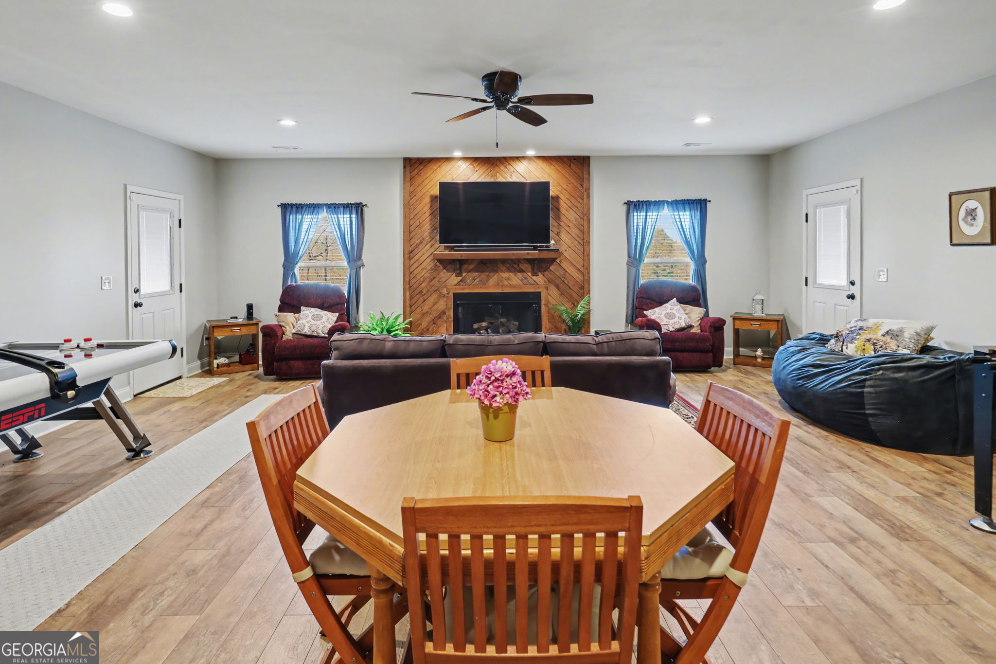 421 Hickory Nut Mountain Road Tallulah Falls, GA 30573 - Photo 89 of 117 a living room with furniture a flat screen tv and a fireplace