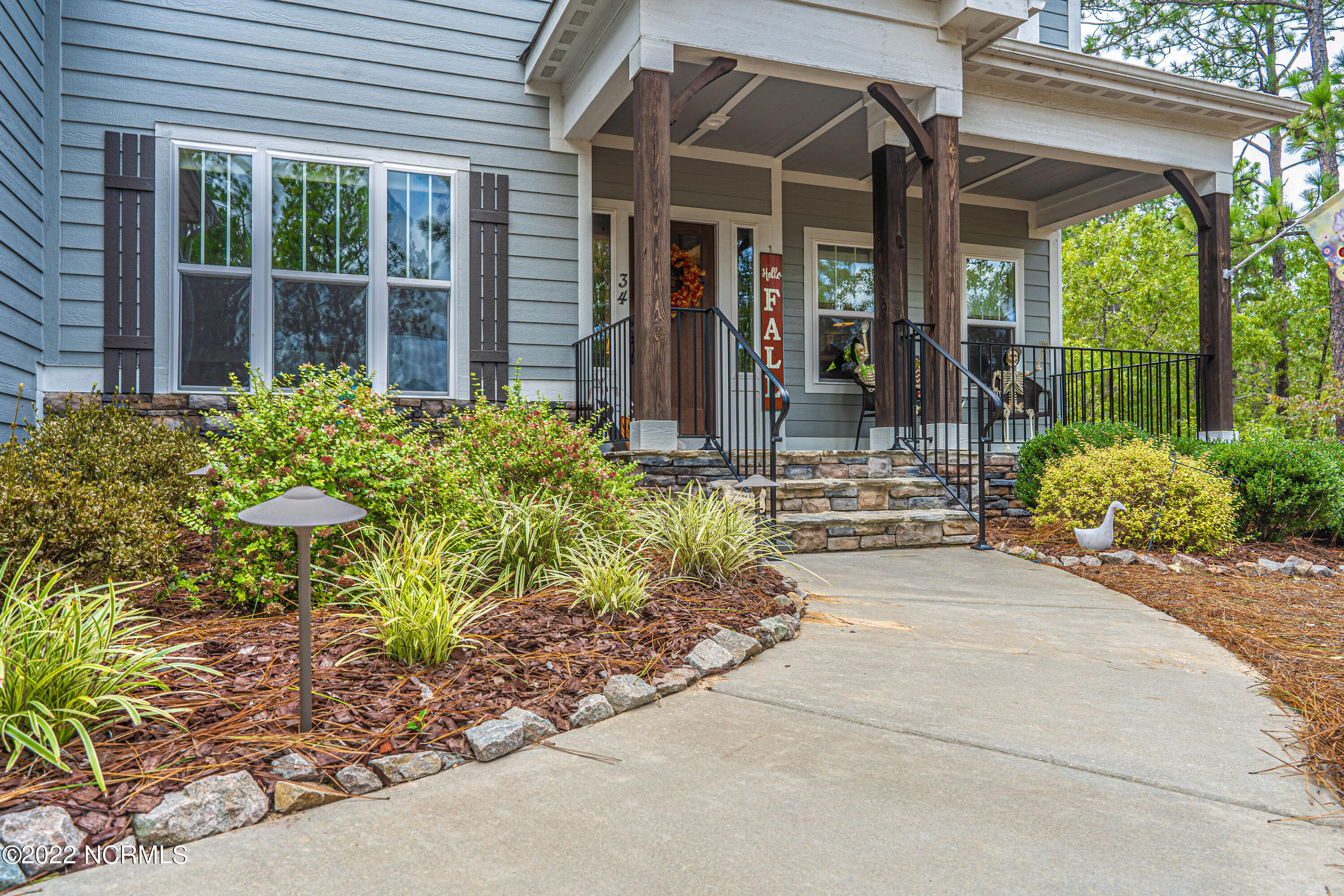 34 Cardinal Drive Whispering Pines, NC 28327 - Photo 6 of 73 front walk
