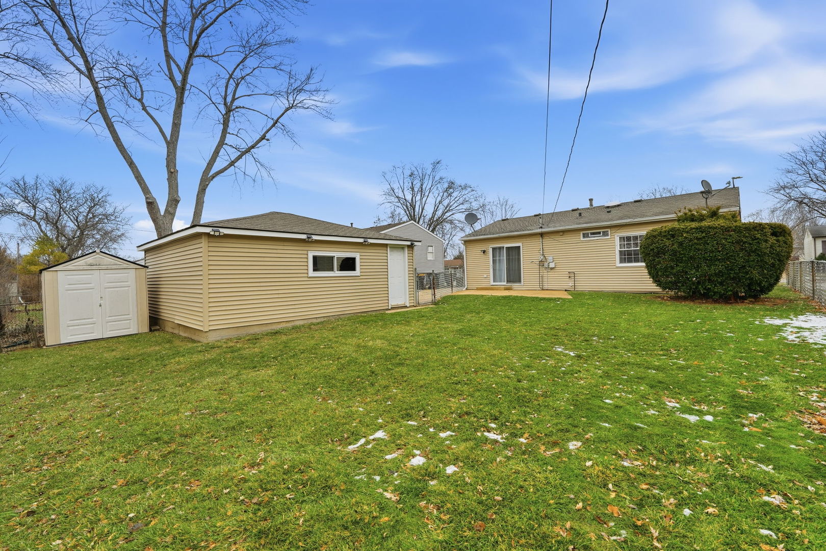 210 Willow Road Streamwood, IL 60107 - Photo 20 of 26 a house view with a garden space