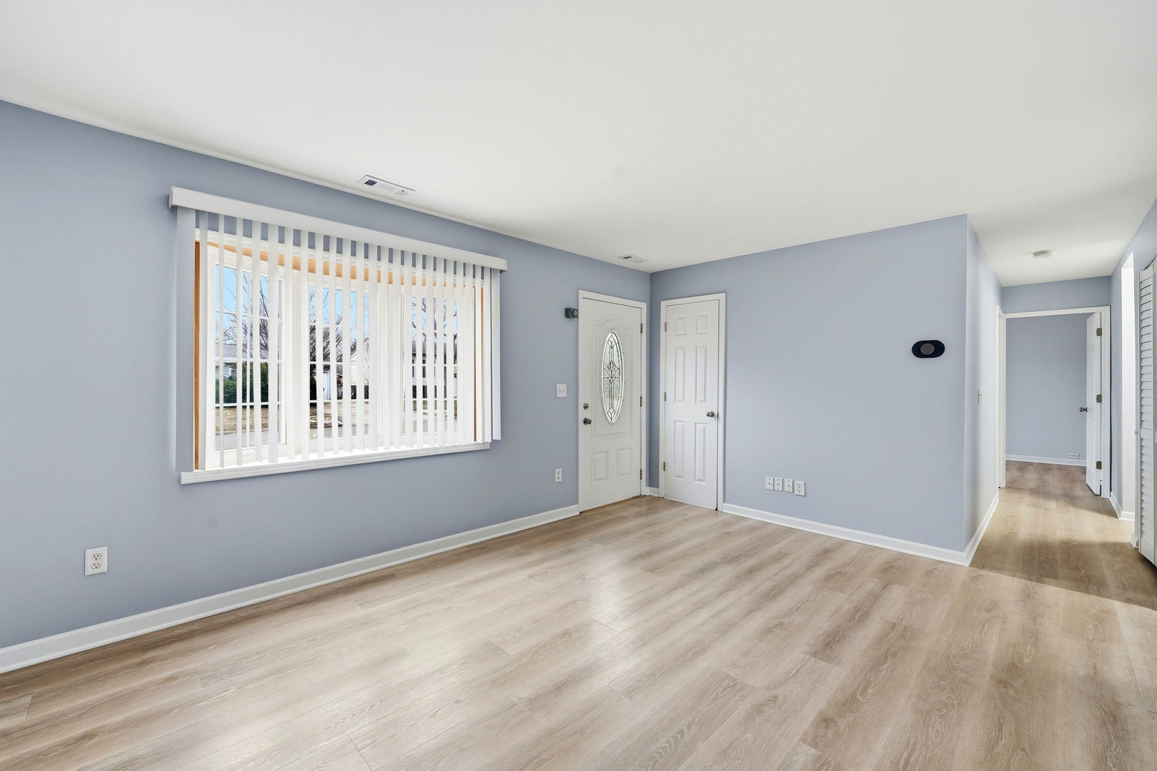 210 Willow Road Streamwood, IL 60107 - Photo 5 of 26 a view of an empty room with a window