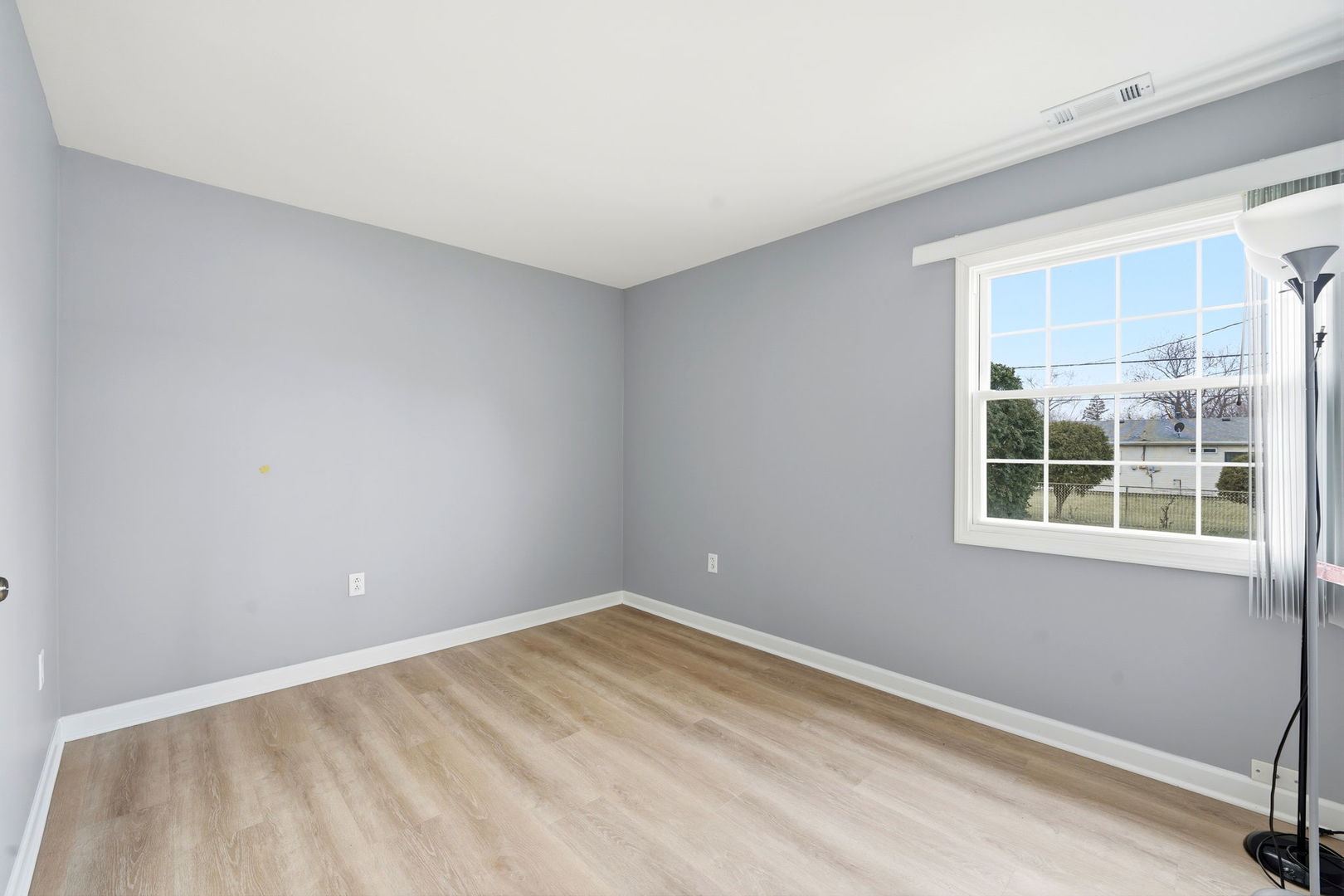 210 Willow Road Streamwood, IL 60107 - Photo 10 of 26 a view of empty room with windows