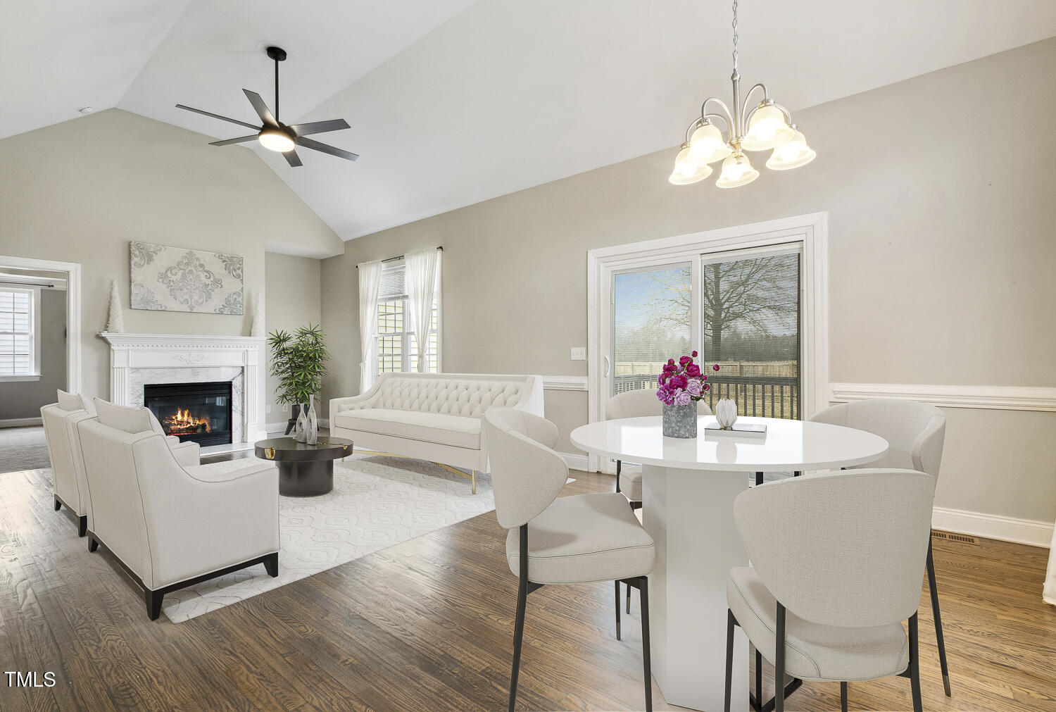 124 D'Ango Circle Angier, NC 27501 - Photo 12 of 42 a view of a dining room with furniture a chandelier and wooden floor