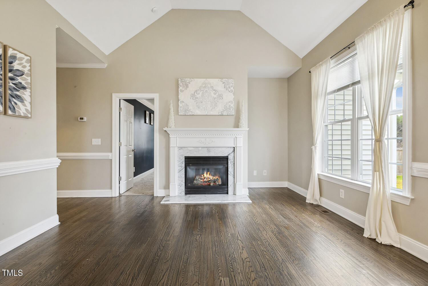 124 D'Ango Circle Angier, NC 27501 - Photo 17 of 42 an empty room with wooden floor fireplace and windows