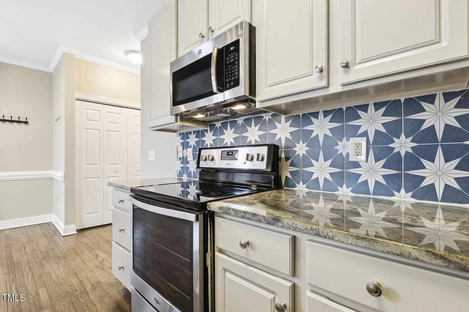 124 D'Ango Circle Angier, NC 27501 - Photo 22 of 42 a kitchen with granite countertop a stove microwave and sink