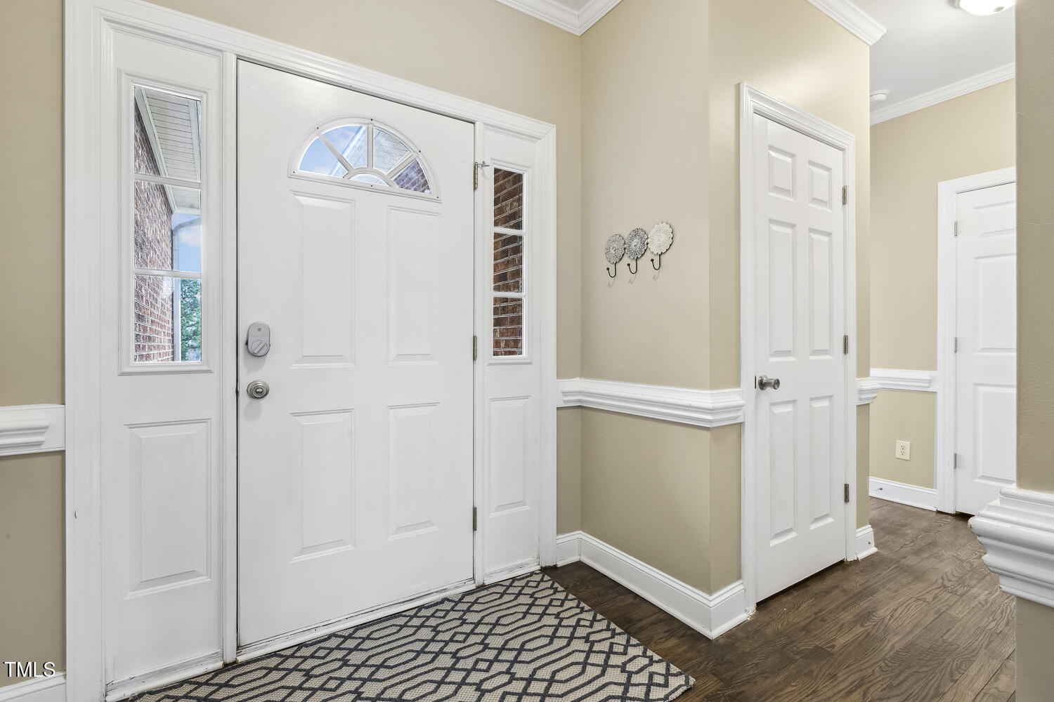 124 D'Ango Circle Angier, NC 27501 - Photo 10 of 42 a view of a livingroom with wooden floor and white cabinet