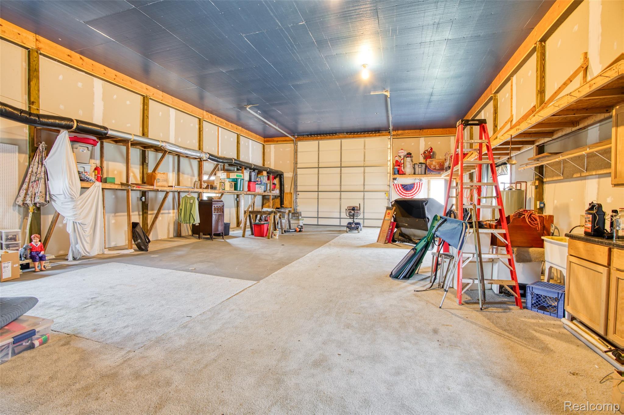 5601 West Lovejoy Road Byron, MI 48418 - Photo 36 of 40 View of garage