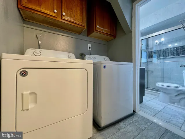 a utility room with dryer and washer