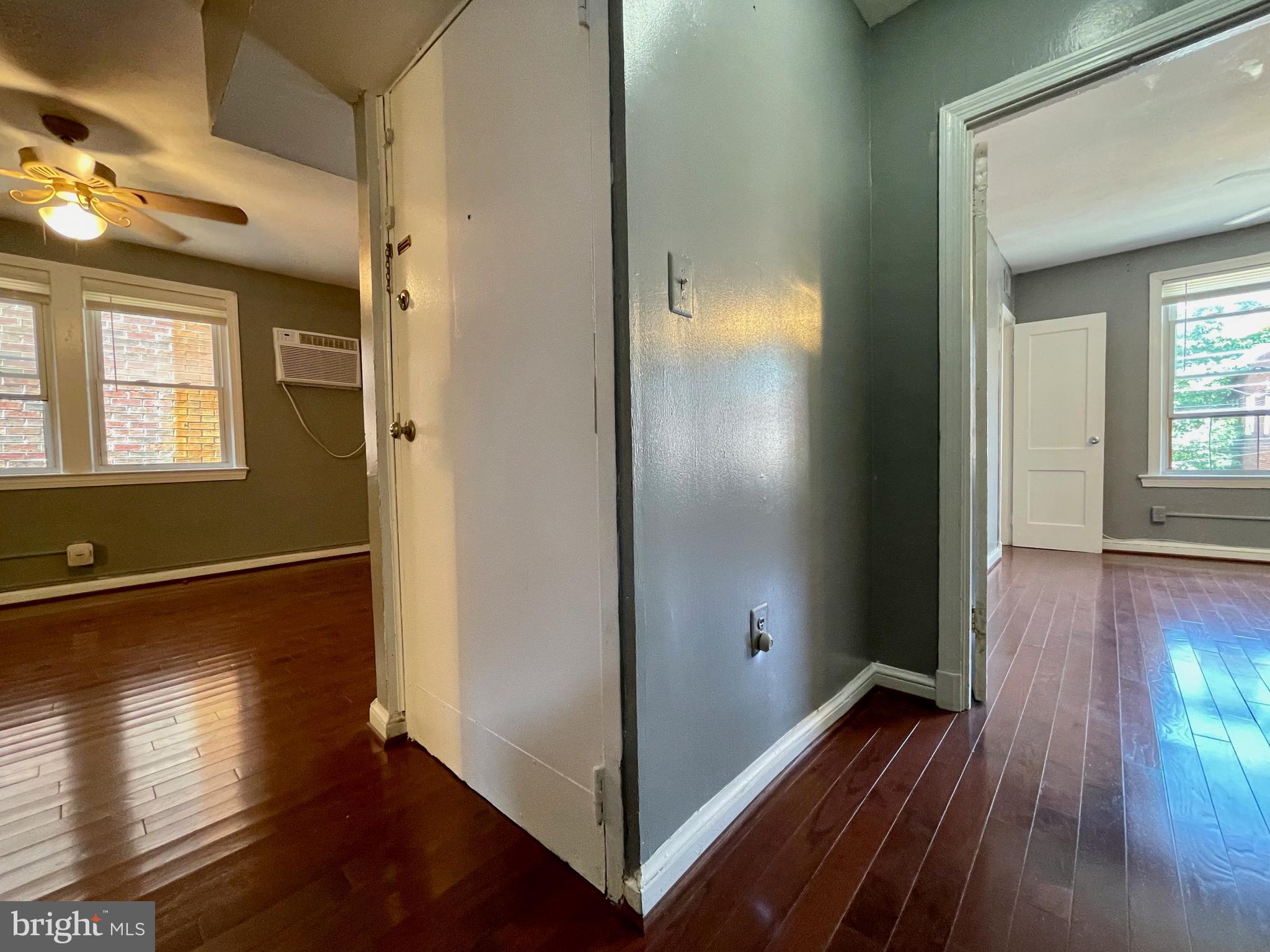 1858 Kendall Street Northeast, Unit 2 Washington, DC 20002 - Photo 18 of 38 a view of a room with wooden floor and staircase