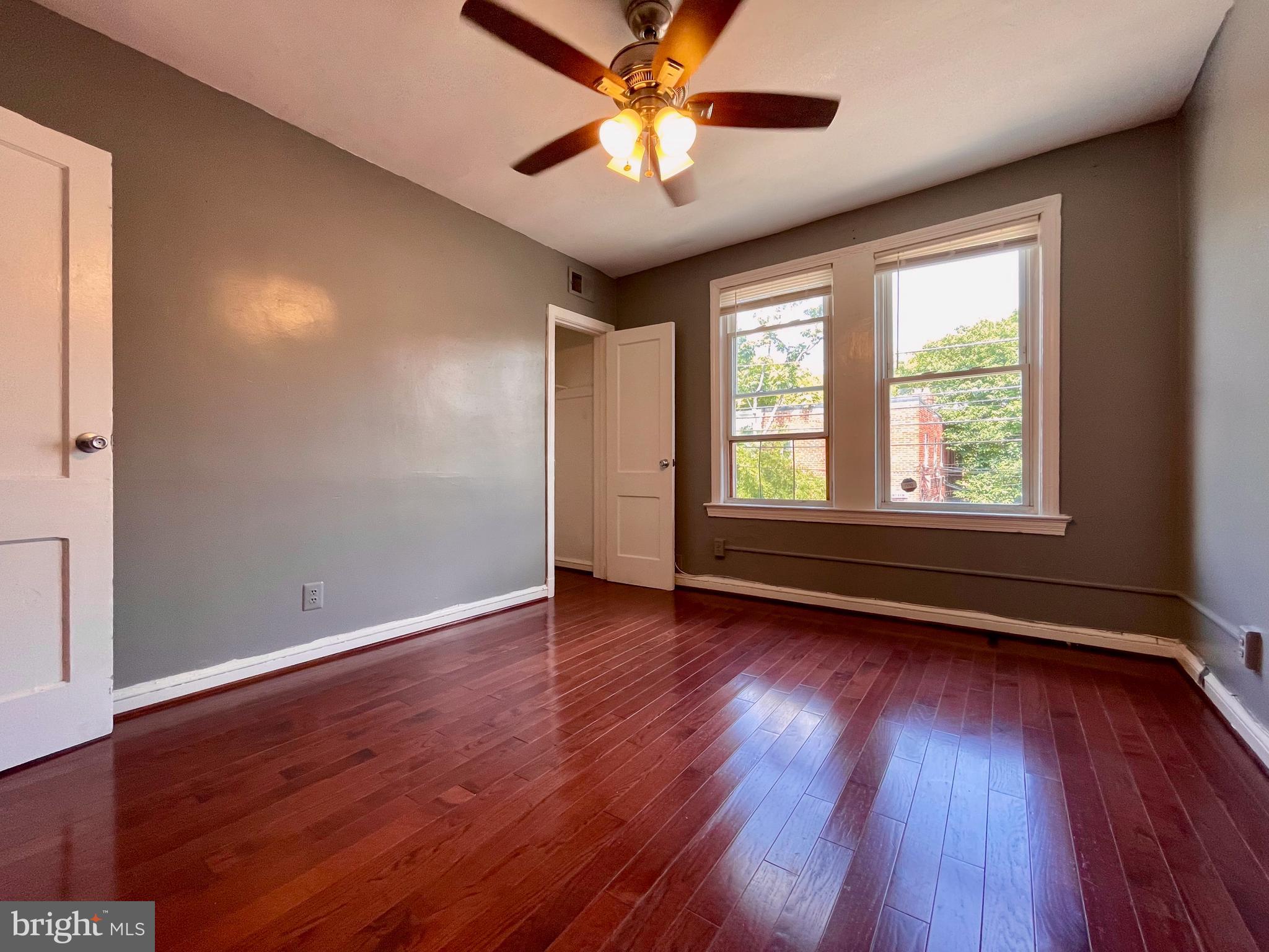 1858 Kendall Street Northeast, Unit 2 Washington, DC 20002 - Photo 22 of 38 a view of room with window ceiling fan and hardwood floor