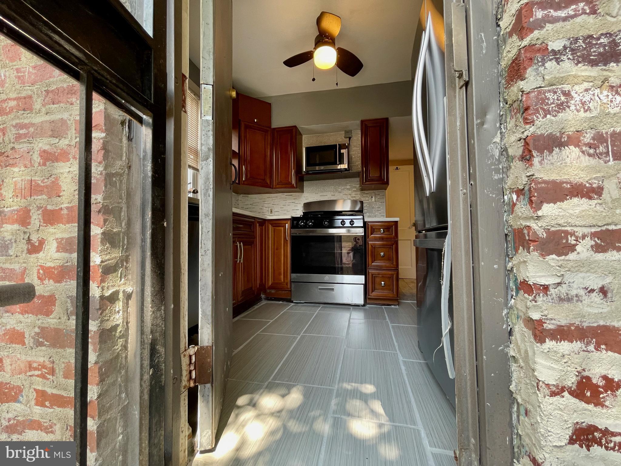1858 Kendall Street Northeast, Unit 2 Washington, DC 20002 - Photo 33 of 38 a view of a kitchen from the hallway