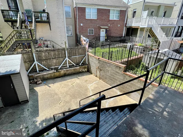 a view of house with a roof deck