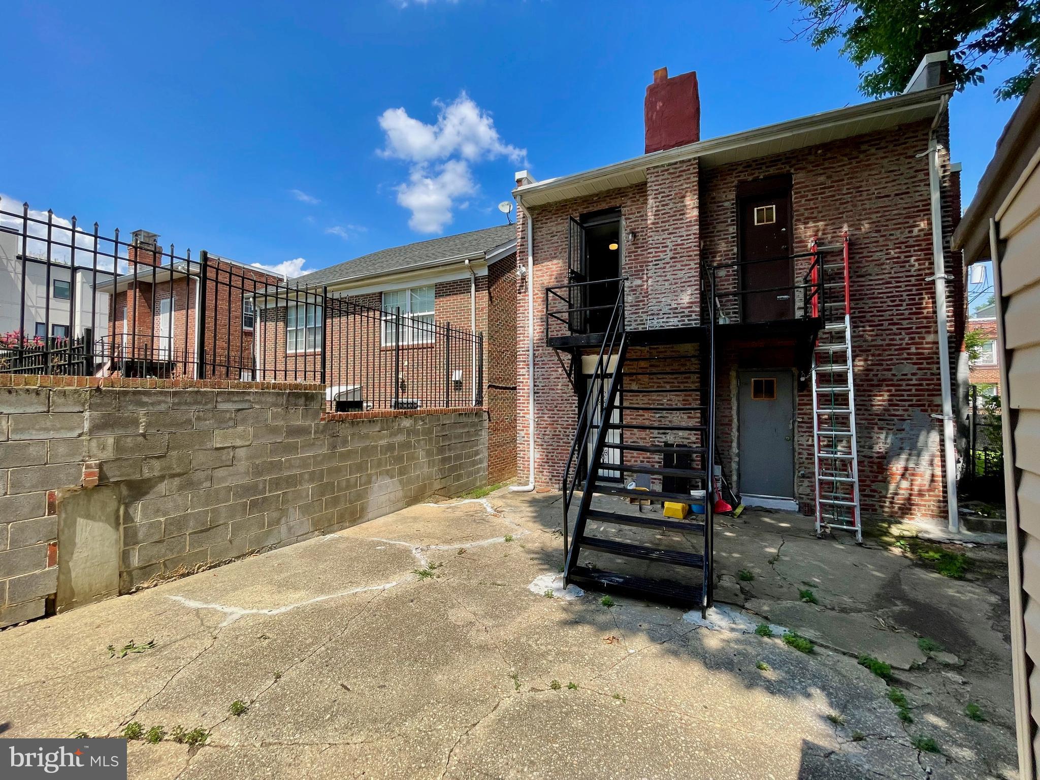1858 Kendall Street Northeast, Unit 2 Washington, DC 20002 - Photo 38 of 38 a front view of a house with a yard