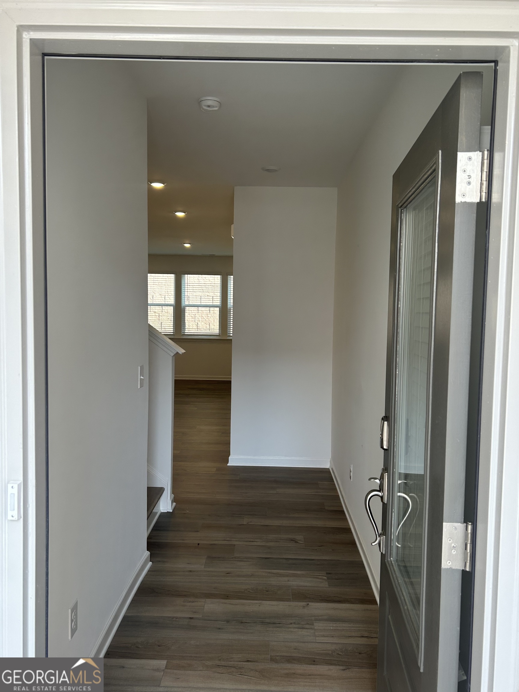 160 Vision Street Bethlehem, GA 30620 - Photo 2 of 11 a view of a hallway with wooden floor and entryway