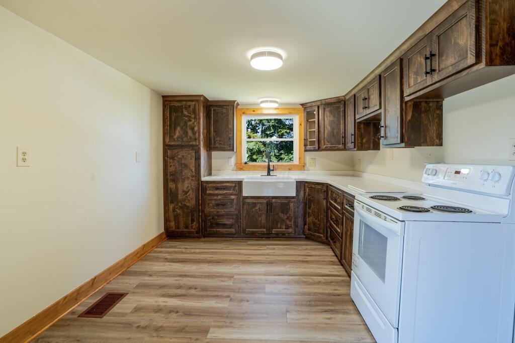 681 Downing Road Stockport, OH 43787 - Photo 25 of 36 Kitchen Sink Stove and Wooden Cabinets