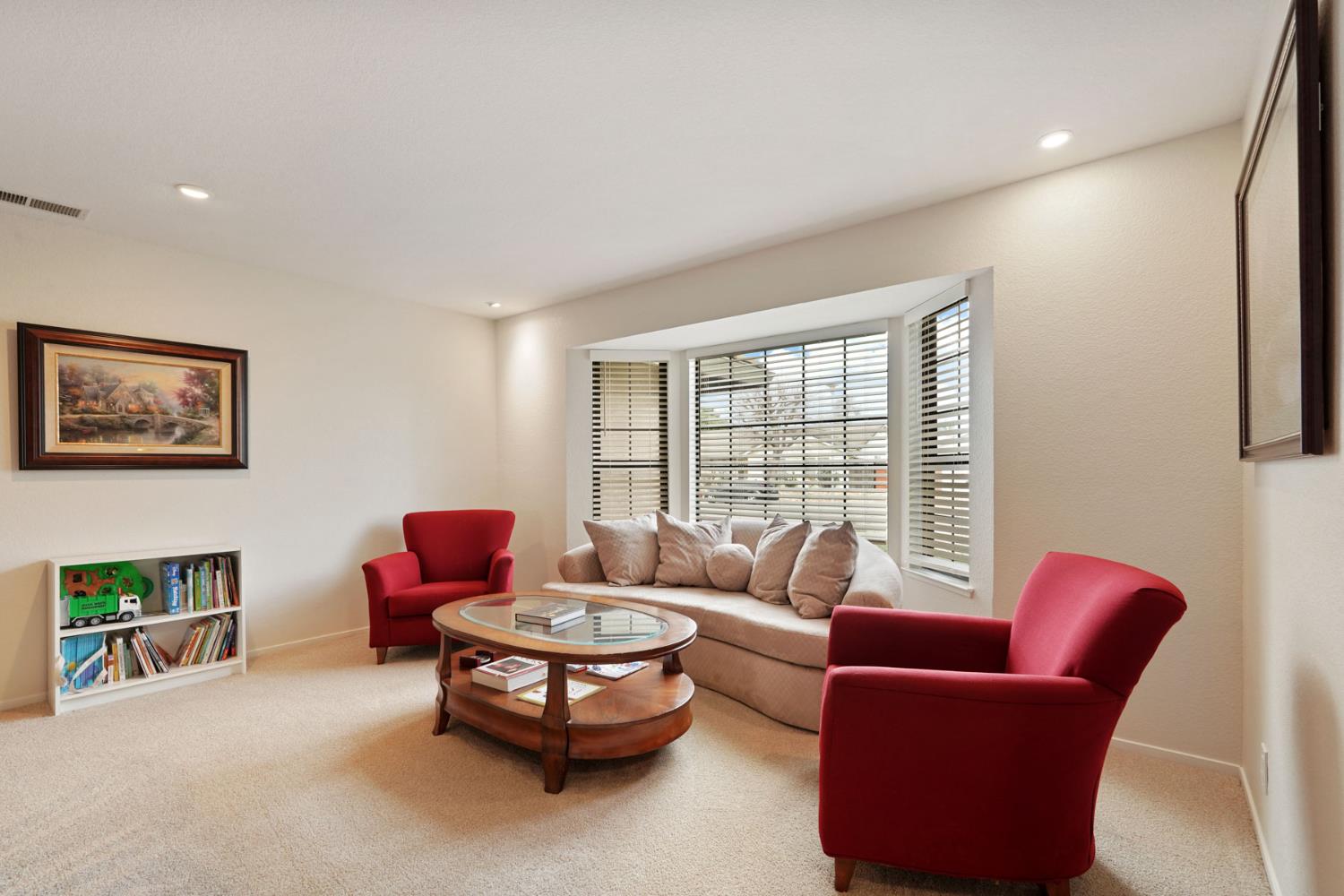 764 Adare Way Galt, CA 95632 - Photo 16 of 59 a living room with furniture and a large window
